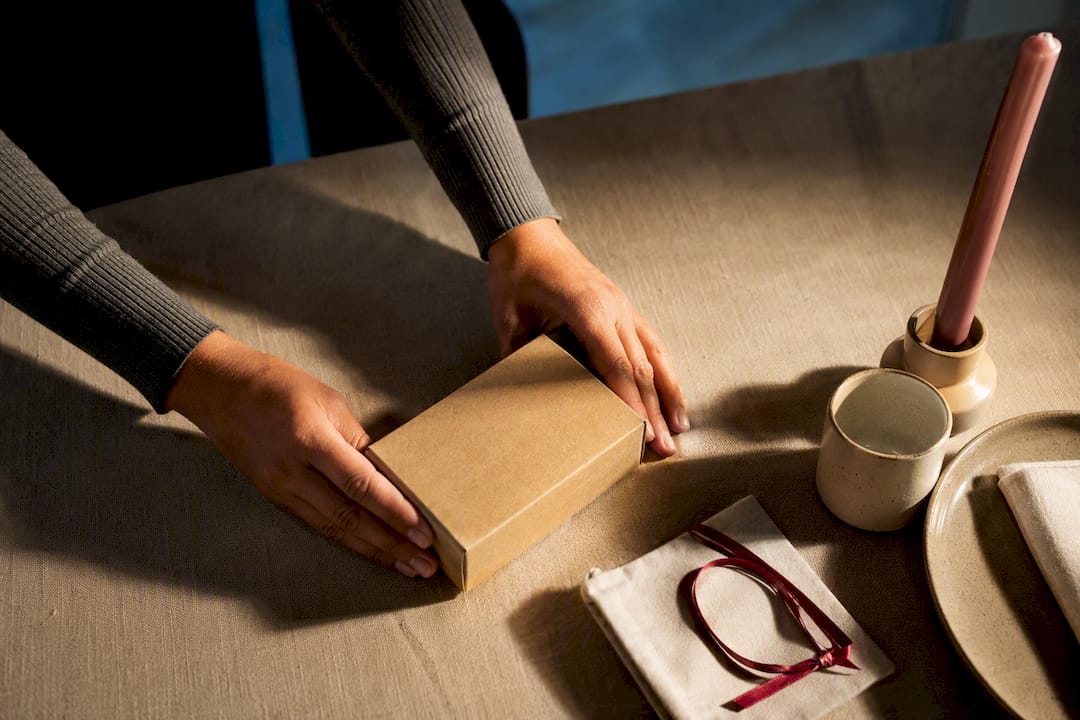 Plainly packaged intimate gift on dining table