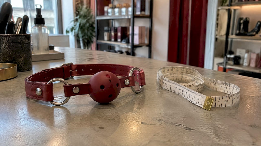 Ball gag and measuring tape on counter