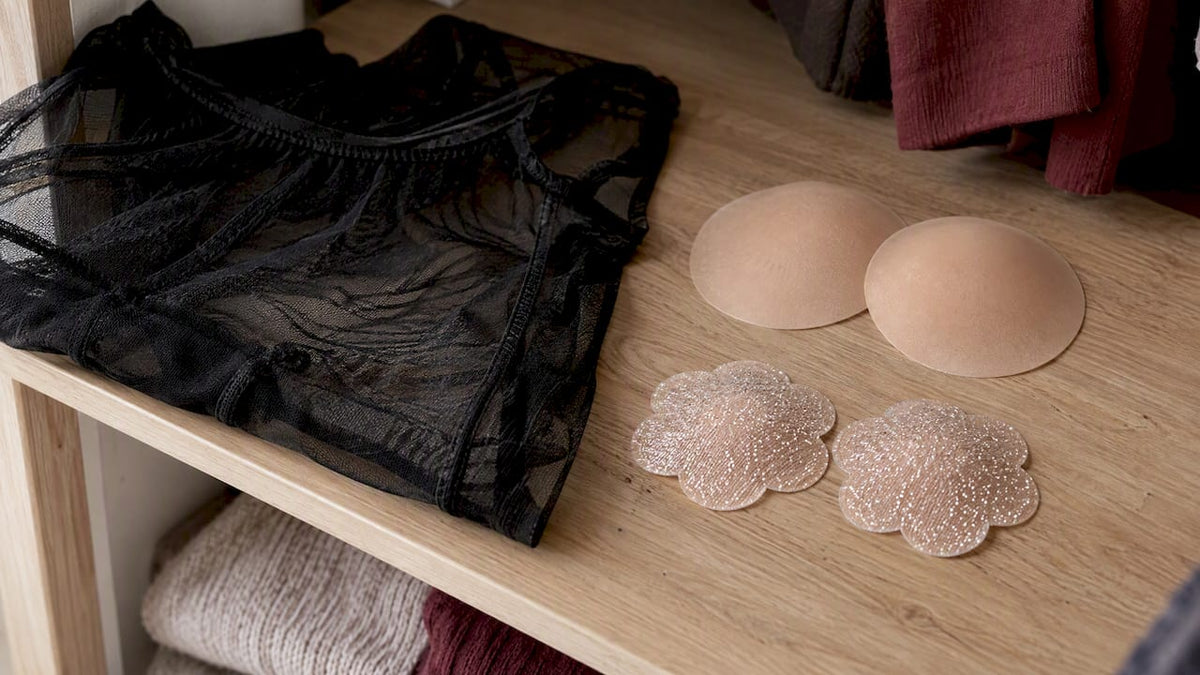 Nipple pasties beside a sheer mesh top